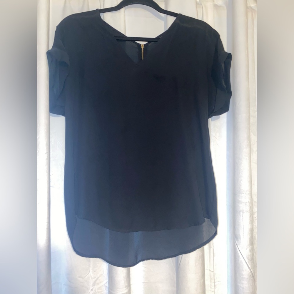 Black blouse with gold zipper down the back